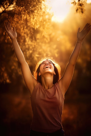 happiness, woman and hands in air for celebration with energy for success, motivation and confidenceの素材