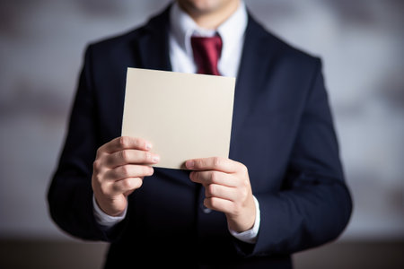 cropped shot of an unidentifiable business owner holding over blank sign with a question mark on itの素材