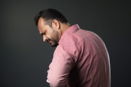 studio shot of an unrecognizable man suffering from a back painの素材