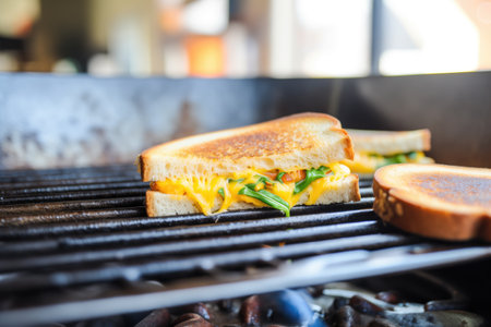 grilled cheese cooking in pan, golden brown crust visibleの素材