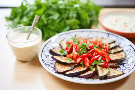 eggplant and roasted red pepper salad, tahini dressing on the sideの素材