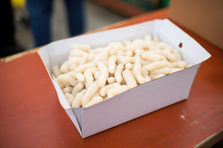 gnocchi in a carton for market displayの素材