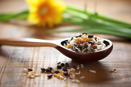 spoonful of rice with black beans and corn on wooden tableの素材
