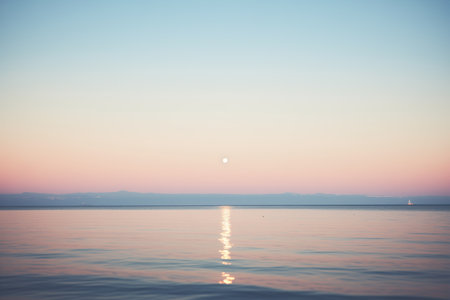 full moon over calm oceanの素材