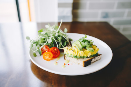 rice cake avocado toast with a side of arugula saladの素材