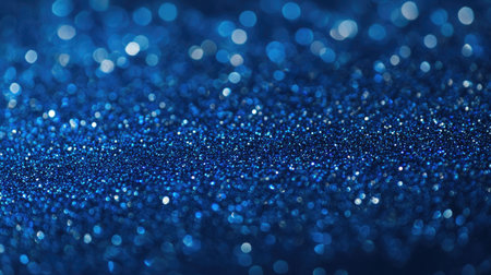 Close-up of a blue sea gradient background showing tiny shimmering details on the water's surface.の素材