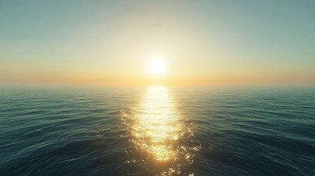 Calm sea with a gradient of sapphire blue to teal, reflecting golden sunlight near the edges.の素材