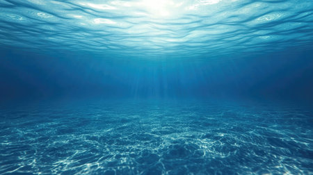 Subtle gradient of calm ocean water in varying blue tones, creating a soothing background.の素材
