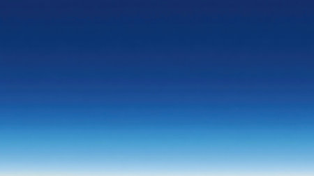Blue sea gradient background blending oceanic shades under a cloudless, light-reflecting sky.の素材