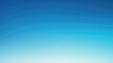 Blue sea gradient background blending oceanic shades under a cloudless, light-reflecting sky.の素材