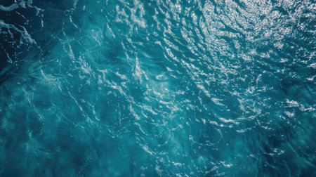 Overhead view of gentle ripples in an Olympic-sized swimming pool, capturing the symmetry and serenity.の素材
