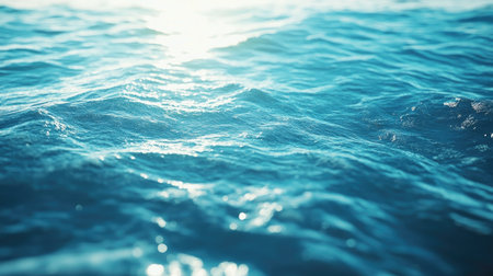 Long exposure of sea surface with a silky blend of aqua and royal blue shades, sunlight casting a gentle glowの素材