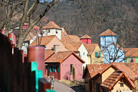 Colorful Houses on hill with a mountain backgroundの写真素材
