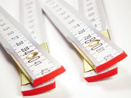 Isolated on white wooden meter prepared for measure
