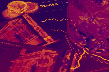Concept of stocks; money, stock graph and a glass of drink.の写真素材