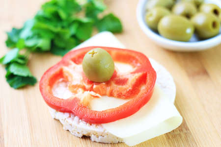 Parsley, red pepper and olive with light cheese for healthy snack の写真素材