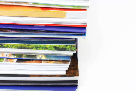 A bunch of magazines on shelf の写真素材