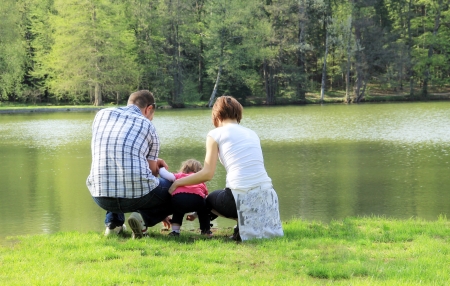 Family near the lake の写真素材