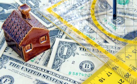 Build new home concept  Small house, ruler, paper money 