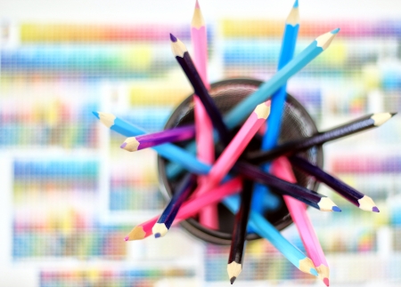 Crayons in the box on colored background の写真素材
