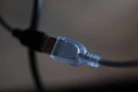 Close up of blue network cable plug in black background. High quality photoの写真素材