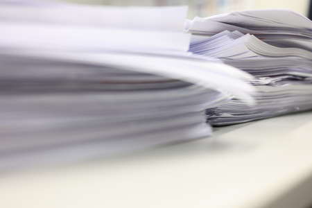 Pile of documents on the table in office. Selective focus.の写真素材