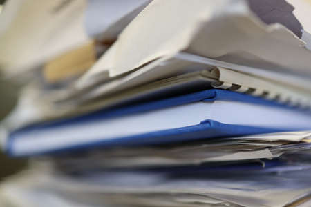Out of focus of pages of documents in a pile. Stack of documents.の写真素材
