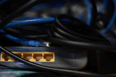 Close-up of a network cable connected to a router. High quality photoの写真素材