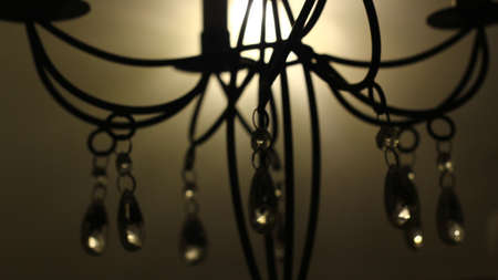 Vintage chandelier close-up. Dark background. Selective focus.