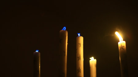 Old candle stick and candles burning down.の写真素材