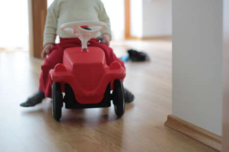 Little boy on a truck in the room.の写真素材