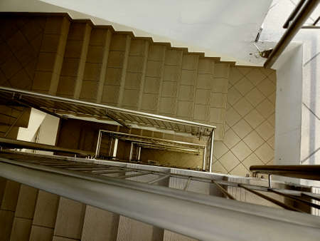 Lobby with stairs and iron shiny stairs fence.