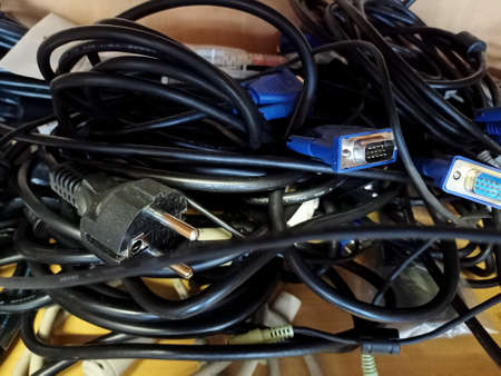 Close-up view of a lot of power cables on the table