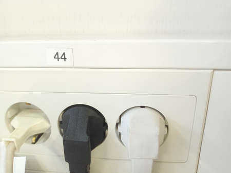 Electrical socket with the number 4 on it. Close-up.