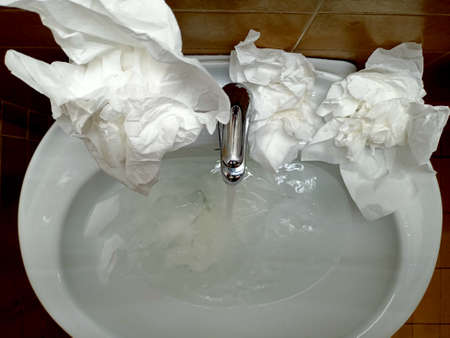 Washing hands with wet tissue in the bathroom. Hygiene conceptの写真素材