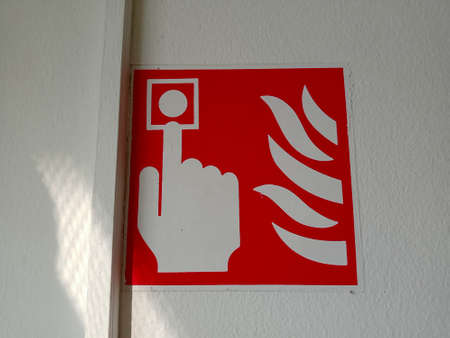 Fire warning sign on the wall in the house. Fire safety.の写真素材