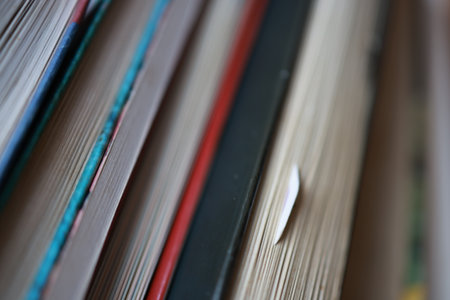 Close up of a stack of books. Selective focus with shallow depth of field.の写真素材