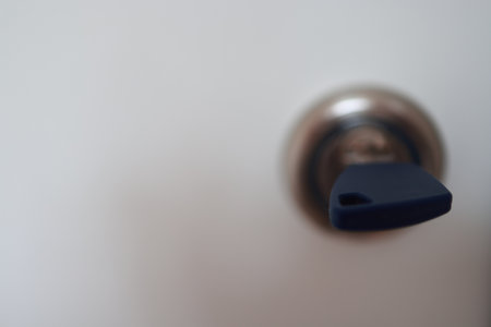 Close up of a door handle in a hotel room. Blurred backgroundの写真素材