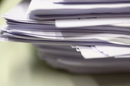 Stack of documents on the desk. Selective focus. Shallow depth of field.