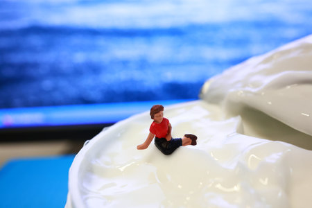 Miniature people sitting on the car.の写真素材