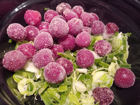 Frozen grapes in a bowl, close-up, selective focusの写真素材