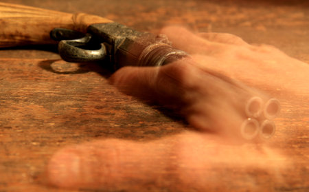 Close-up shot of a carpenter's hand holding a wood tool
