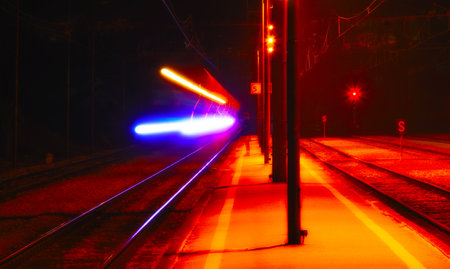 Railway tracks in the city at night. Long exposure photo.