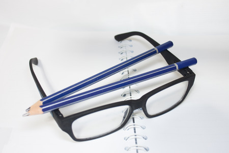 paper with pencil and glassesの写真素材
