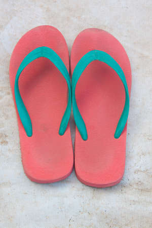 Red slippers green line on the white road の写真素材