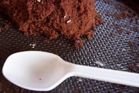 Cake and plastic spoonの写真素材