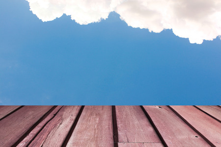 Wooden pier on blue sea and sky background の写真素材