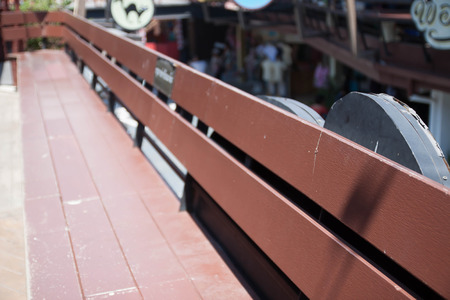 Brown wooden seat at old market in Thailand の写真素材