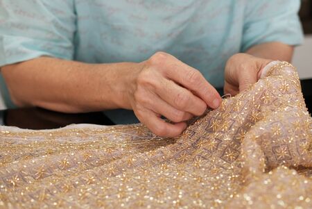 The dress maker is sewwing Thai dress.の写真素材