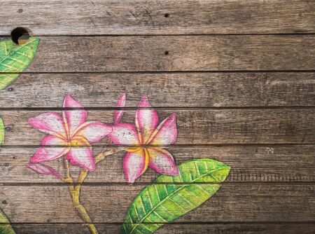 flower painting on old wooden coffee tableの写真素材